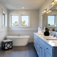 Bathtub and sinks in bathroom